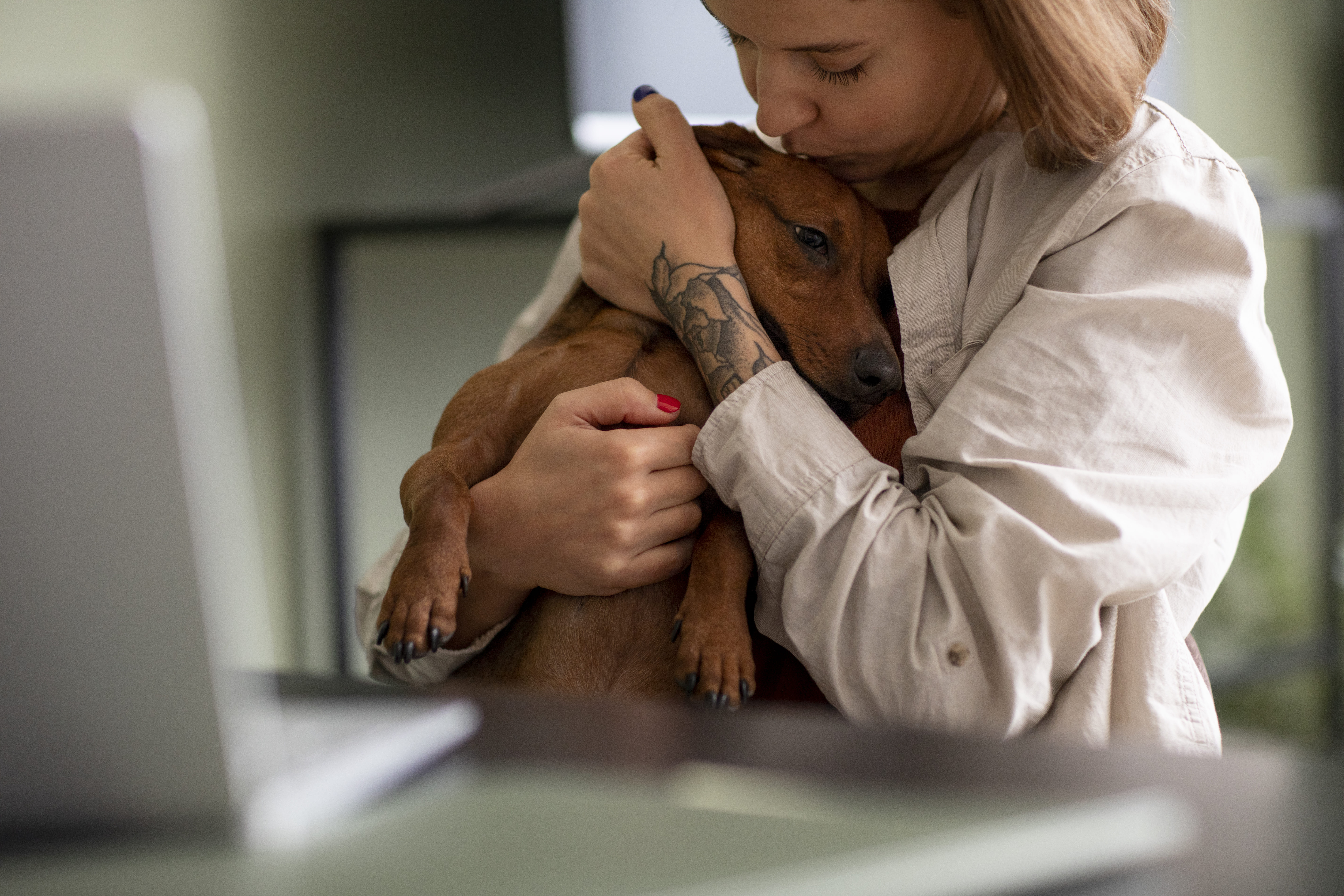 The Therapeutic Benefits of Pet Ownership - woman hugging her pet dog