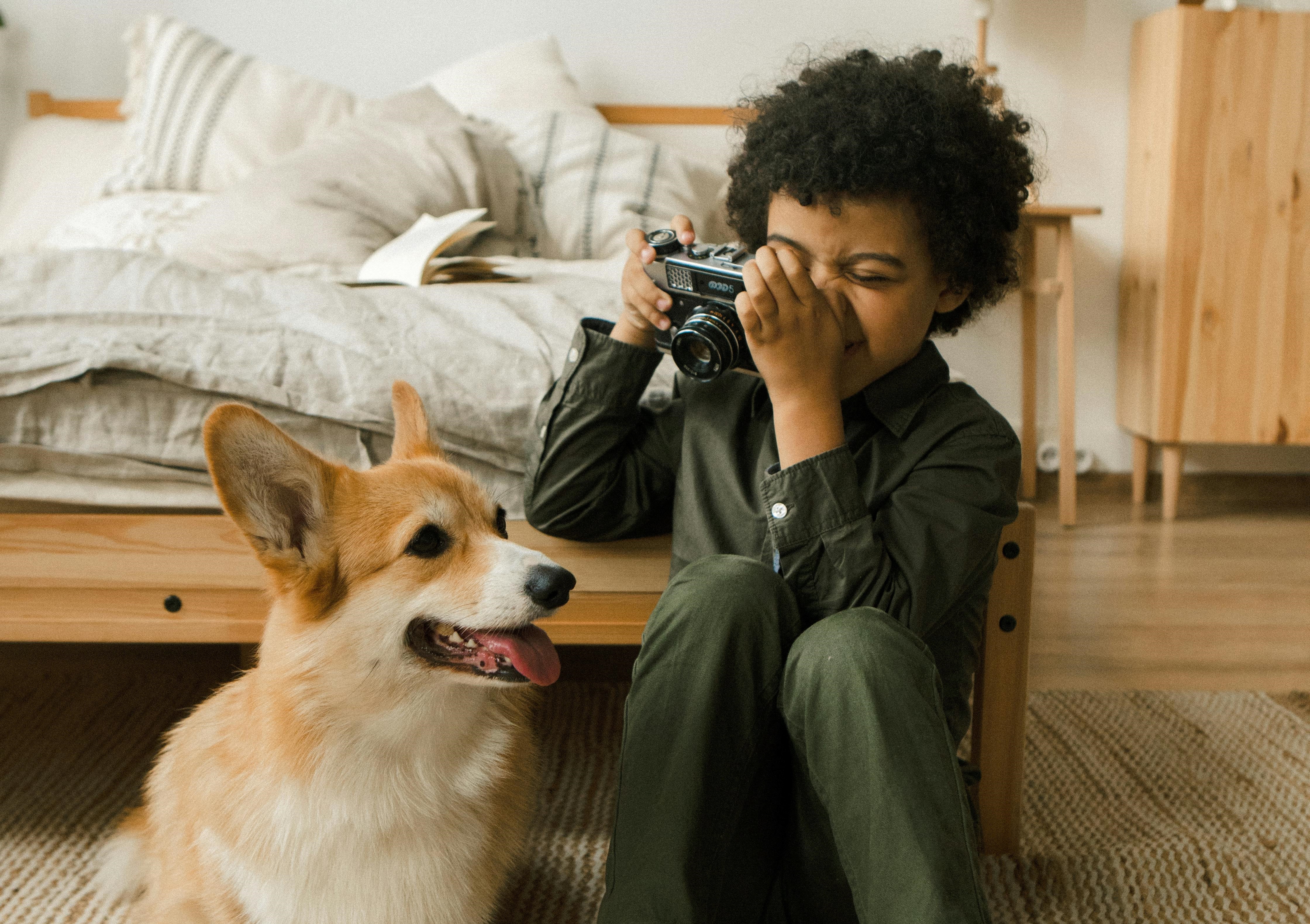 Pet Ownership Challenges: Boy With A Camera Filming His Dog
